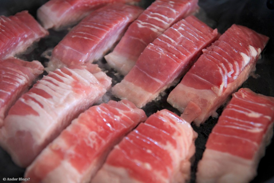 Slow Cooking Sliced Bacon © Andor